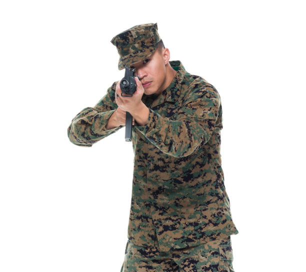istock US Marine in uniform aiming rifle 1050863868