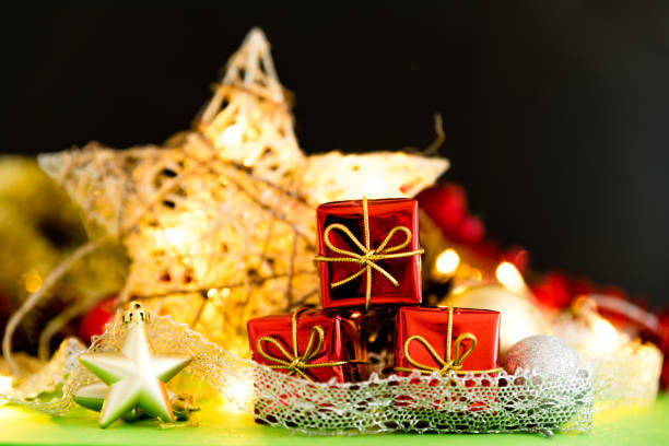 istock red gifts and illuminated star with christmas background 1050870898