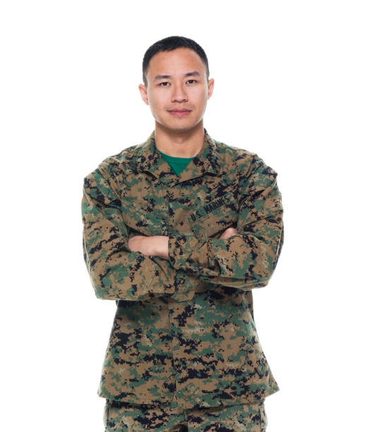 istock US Marine in uniform with arms crossed 1050871606