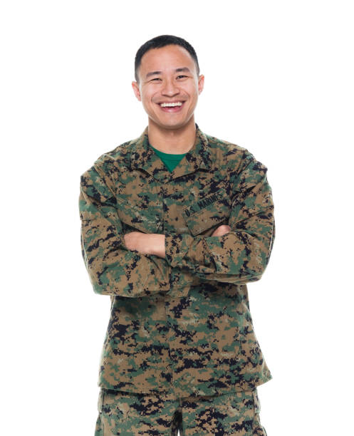 istock US Marine in uniform with arms crossed 1050871820