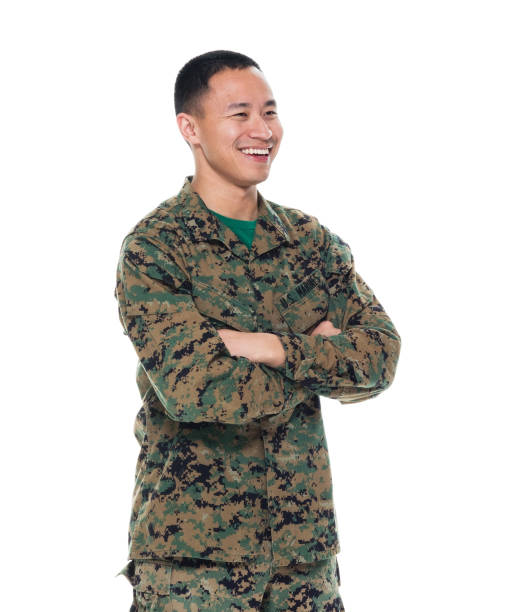 istock US Marine in uniform with arms crossed 1050872166