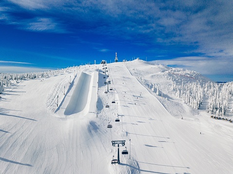 Modern ski chair-lift in Finland Lapland ski resort. Aerial view from above. Drone photography