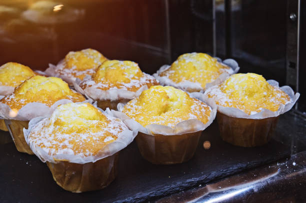 istock Fresh muffins cupcake in powdered sugar 1050875918