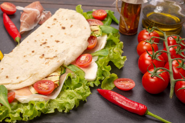 istock Piadina romagnola with cheese and ham 1050880404