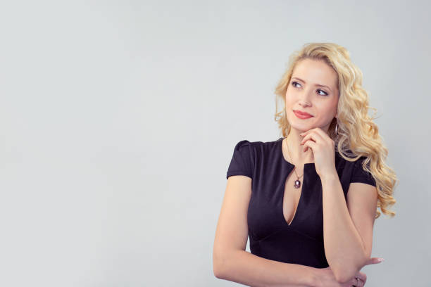 istock Pretty dreaming woman looking away 1050882636