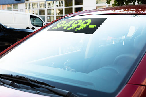 Close-up Of Car With Numbers On Windshield
