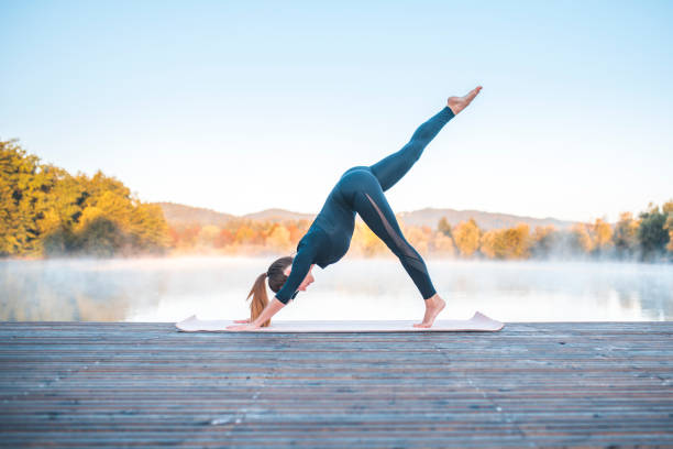 istock Yoga pose - one legged downward facing dog pose (eka pada adho mukha svanasana) 1050889100