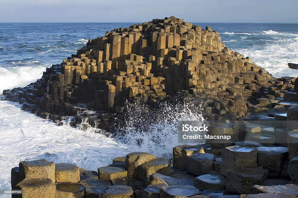 Giants Causeway, Northern Ireland Basalt columns rising from the sea. This geological feature results from erosion on ancient volcanic larva. This unique tourist attraction is the feature of some lovely Irish legends. Giants Causeway Stock Photo