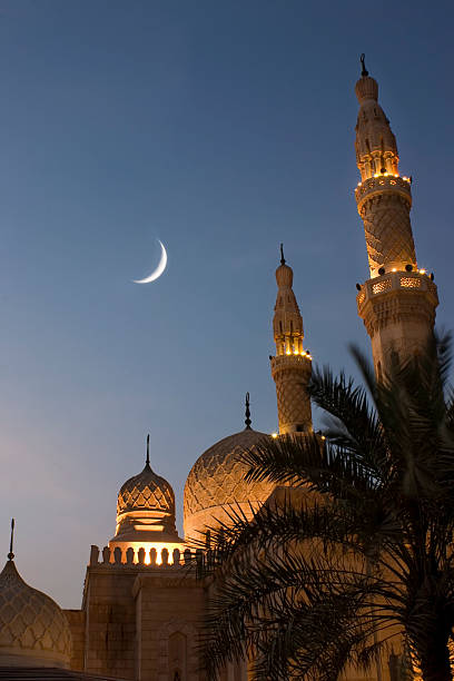 Mosque at sunset Jumeirah mosque at dusk with crescent moon jumeirah stock pictures, royalty-free photos & images