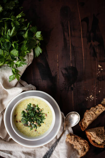 istock Traditional dinner with winter squash soup on texture wooden table. Rural Scene. 1050903546