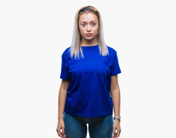 istock Young blonde woman over isolated background with serious expression on face. Simple and natural looking at the camera. 1050906552
