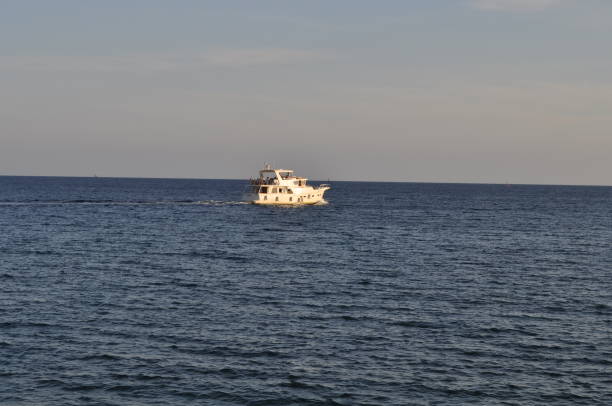 istock The beautiful boat in open sea 1050909832