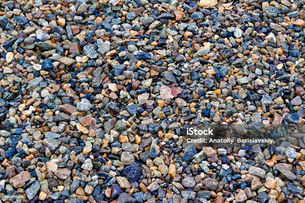 Crushed stones texture background. Stones construction rocks.Grey granite gravel texture background. top view. Crushed stones texture background. Stones construction rocks. Abstract Stock Photo