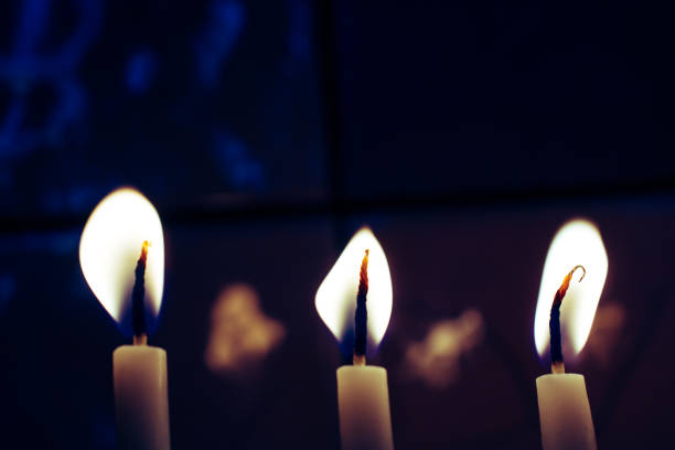 istock Candles burning in the dark with candle flame 1050921726