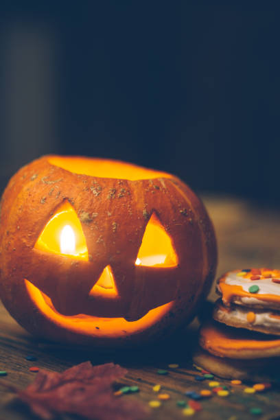 istock Halloween background with pumpkin on the wooden table. 1050924700
