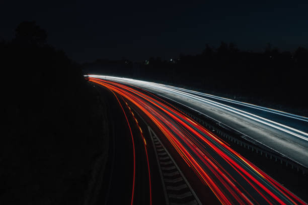 istock Headlights and Taillights on Motorway at Night in UK 1050930668