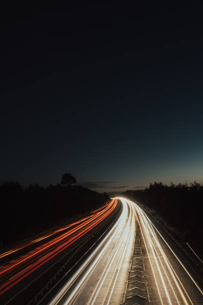 istock Headlights and Taillights on Motorway at Night in UK 1050930962
