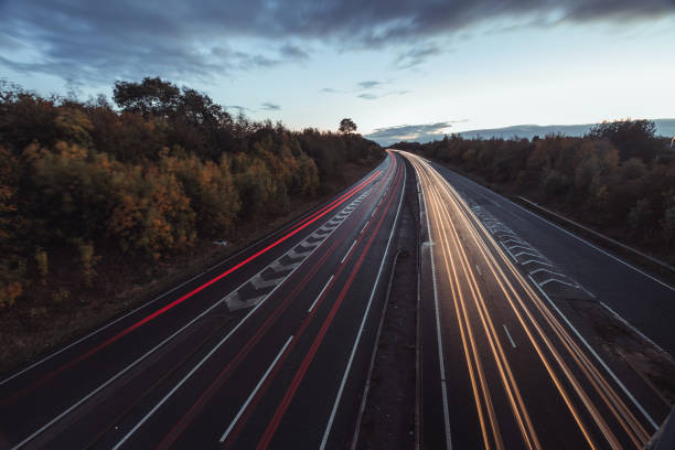 istock Headlights and Taillights on Motorway at Night in UK 1050931020