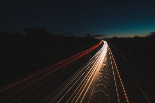 istock Headlights and Taillights on Motorway at Night in UK 1050931842