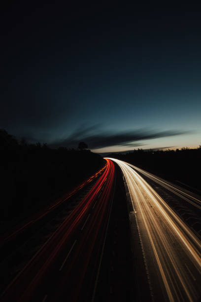 istock Headlights and Taillights on Motorway at Night in UK 1050932790