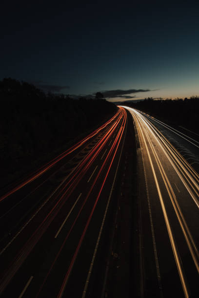 istock Headlights and Taillights on Motorway at Night in UK 1050933218