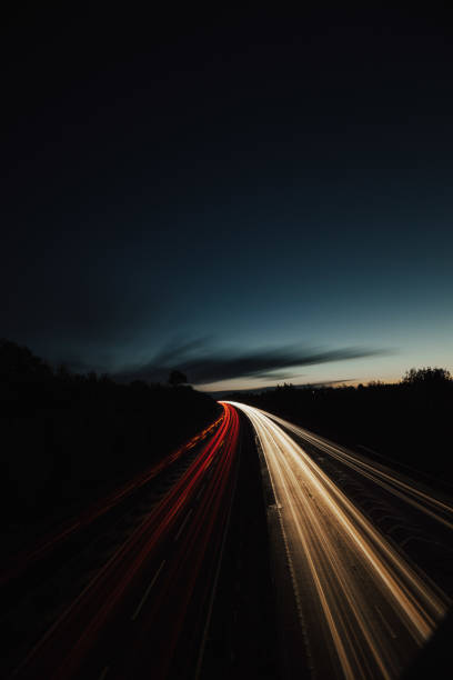 istock Headlights and Taillights on Motorway at Night in UK 1050933352