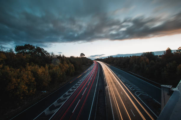 istock Headlights and Taillights on Motorway at Night in UK 1050933402