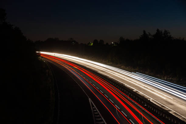 istock Headlights and Taillights on Motorway at Night in UK 1050933748