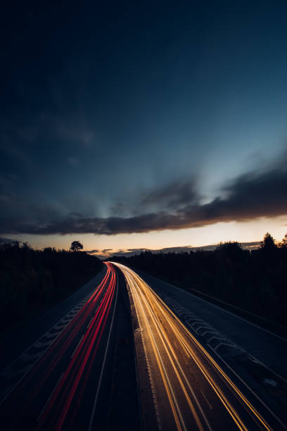 istock Headlights and Taillights on Motorway at Night in UK 1050935376