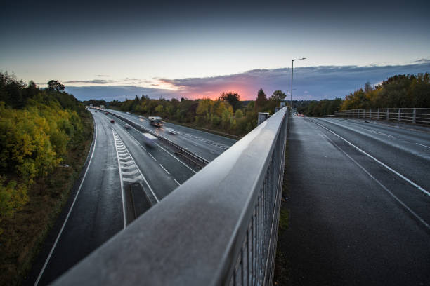 istock Headlights and Taillights on Motorway at Night in UK 1050936312