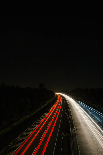 istock Headlights and Taillights on Motorway at Night in UK 1050936470