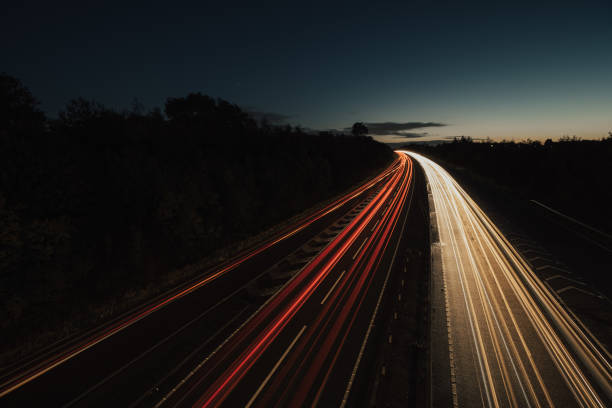 istock Headlights and Taillights on Motorway at Night in UK 1050936490