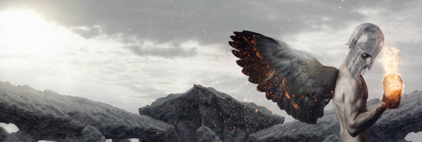 istock muscular knight with wings in fire lifting burning dumbbell in front of cliffs 1050938970