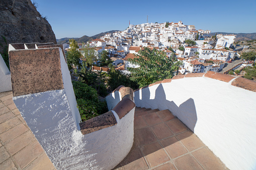 Comares cityscape. White village up on the hill of Malaga mountains, Andalusia, Spain. Panoramic view