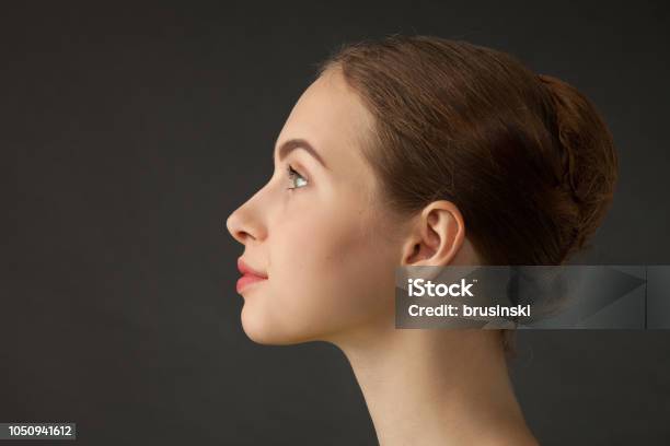 Studio Portrait Of An Attractive 18 Year Old Woman Stock Photo - Download Image Now - Profile View, One Woman Only, Human Face