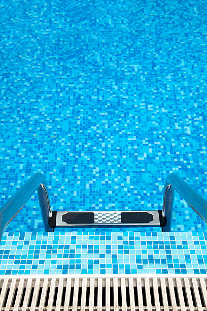 istock Part of swimming pool with ladder 105094507