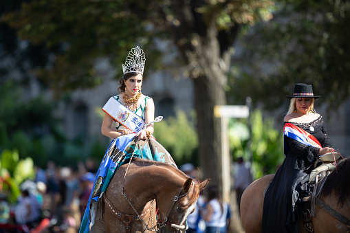 Washington, D.C., USA - September 29, 2018: The Fiesta DC Parade, Mexican Beauty queen Miss Fiesta DC, riding a horse going down the street