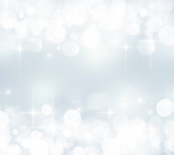 istock Festive blurred bokeh background, white circles on blue, Christmas, background for design, glitter, radiance, asterisks 1050956236