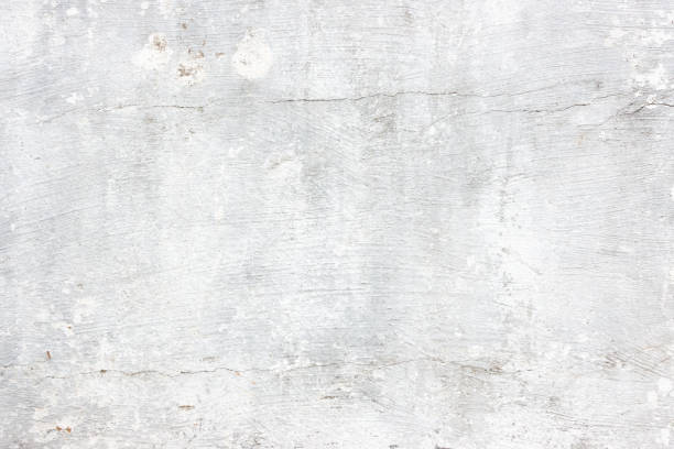 istock Modern grey paint limestone texture background in white light seam home wall paper. Back flat subway concrete stone table floor concept surreal granite quarry stucco surface background grunge pattern. 1050958610