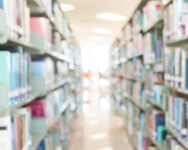 istock Blur school library or study room with book shelves for education background 1050964208