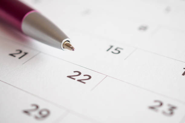istock Calendar page with pen point at 22nd date 1050964260