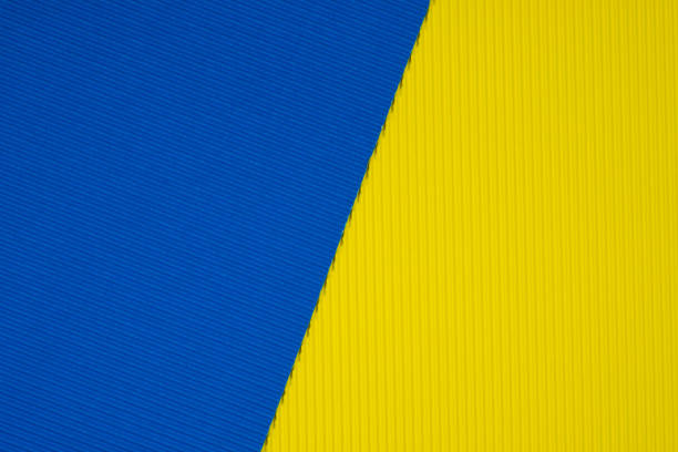 istock Blue and yellow corrugated paper texture, use for background. vivid colour with empty space for add text or object. 1050964870