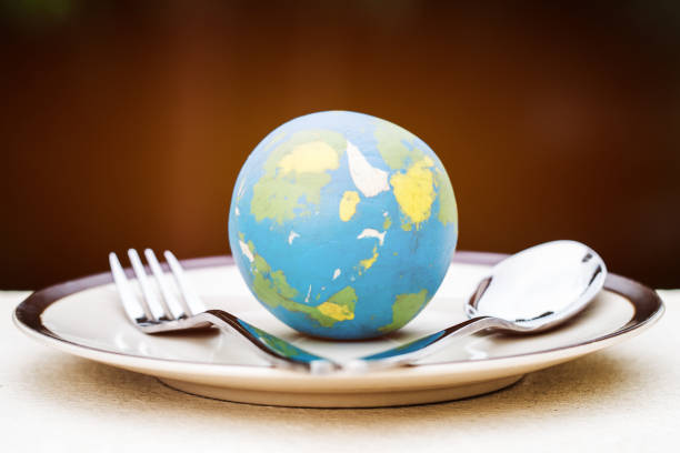 istock Globe model placed on plate with fork spoon for serve menu in famous hotels. International cuisine is practiced around the world often associated with specific region country. World food inter concept 1050970672