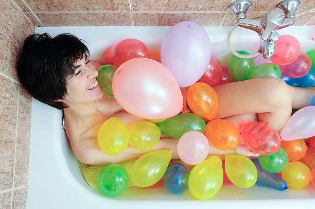 istock Laughter in the bathroom with balloons 105098837