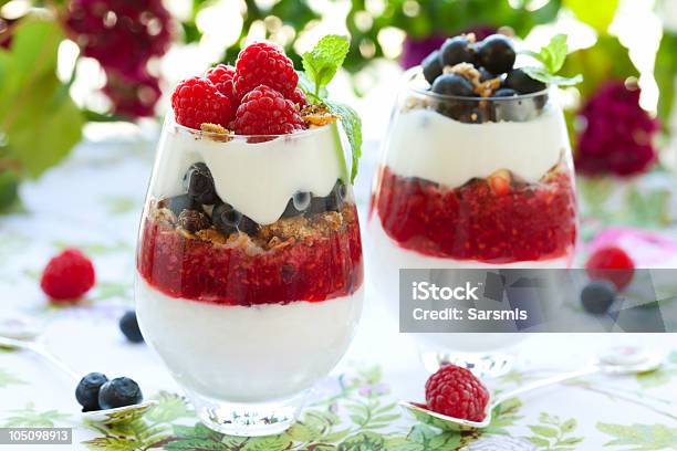 Raspberry And Blueberry Parfait Stock Photo - Download Image Now - Glass - Material, Raspberry, Whipped Cream