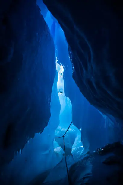 Photo of Looking toward the exit of a large ice cave moulin/crevasse in the Matanuska Glacier, Alaska