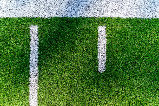 American Football Field Background Yard Line Aerial An American football field yard line background aerial view with copy space. american football field photos stock pictures, royalty-free photos & images