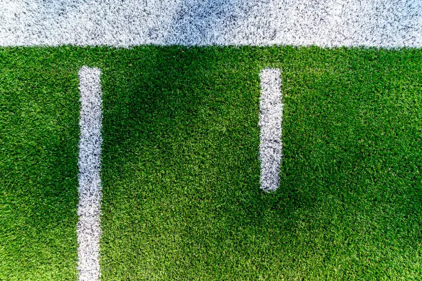 An American football field yard line background aerial view with copy space.