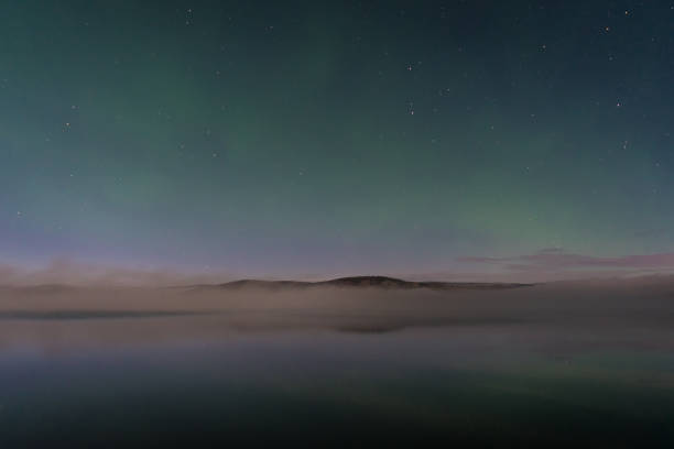 Faint northern lights above the lake