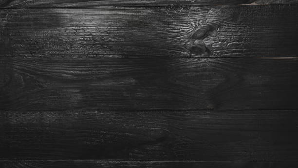 istock Upper, top view of a black wooden blackboard background in old, rustic style 1051002994
